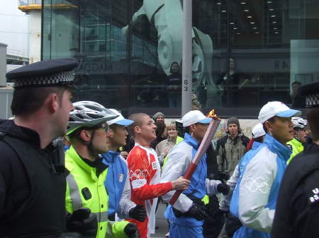 The flame is carried past the Unicorn Theatre in T