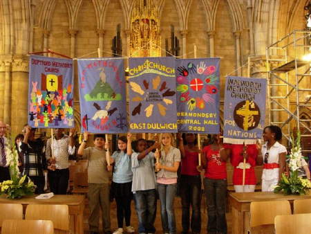 Young people carrying banners from the five church