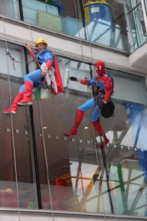 Spiderman and Superman abseil into the Evelina Hospital