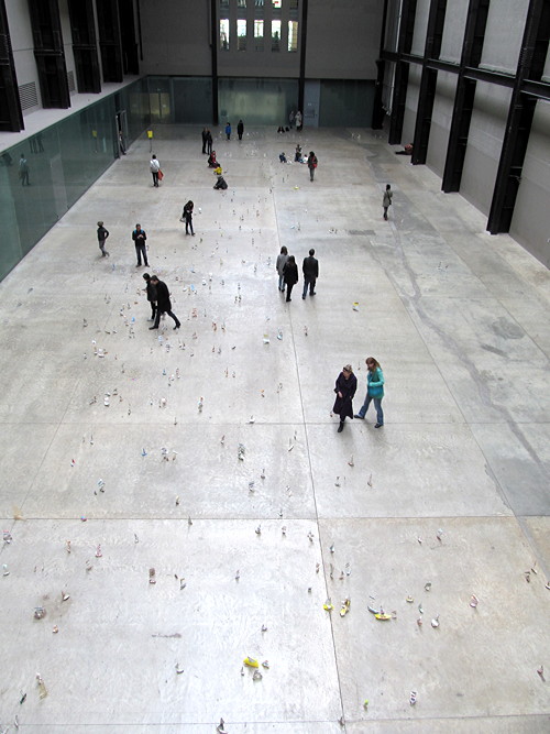 Tate Modern turbine hall filled with flotilla of paper boats