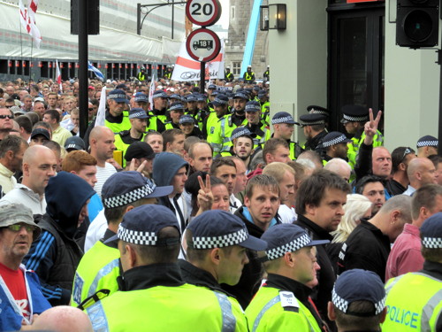 English Defence League supporters march across Tower Bridge