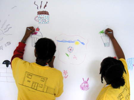 Cathedral School pupils decorate a wall in the Art