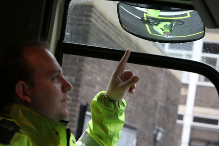 Cyclists get in the cab of a lorry at Southwark road safety event