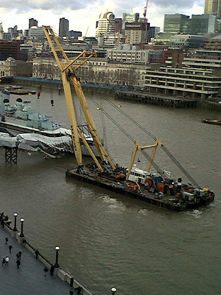 Giant crane lifts HMS Belfast’s collapsed gangway out of the river