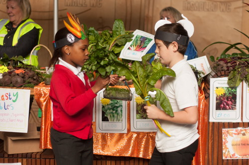 Young traders sell their harvest produce at Borough Market