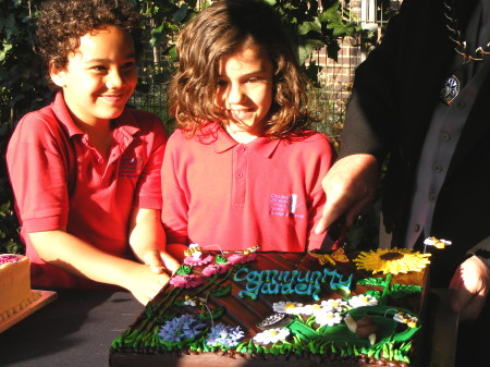 Cake cutting at Tate community garden