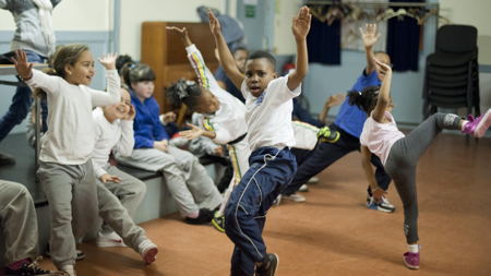 Tabard Gardens kids perform in front of thousands at Millwall QPR match